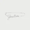The Silver-Tone Gaultier Brooch